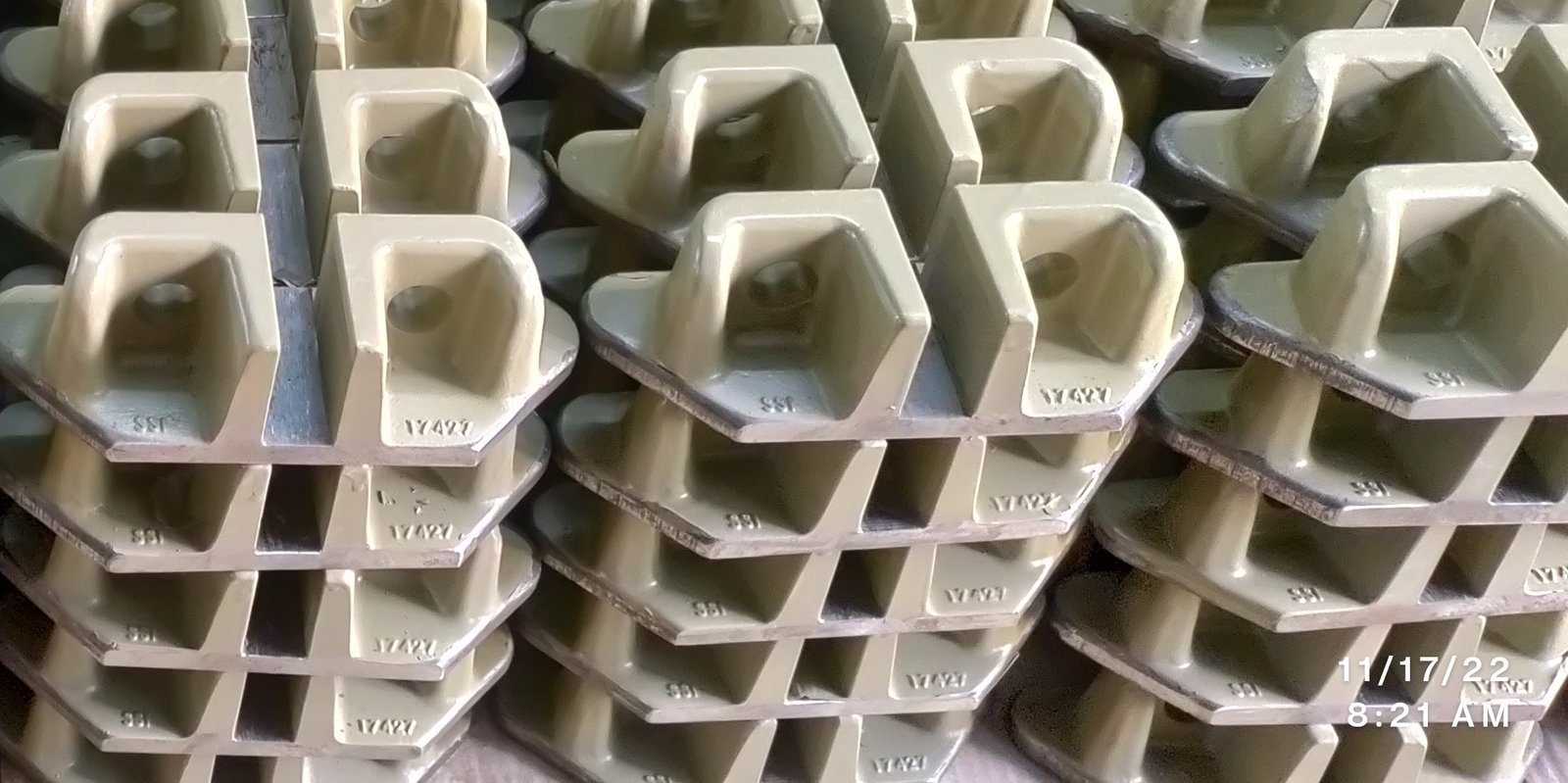 Stacked steel pipes with crane