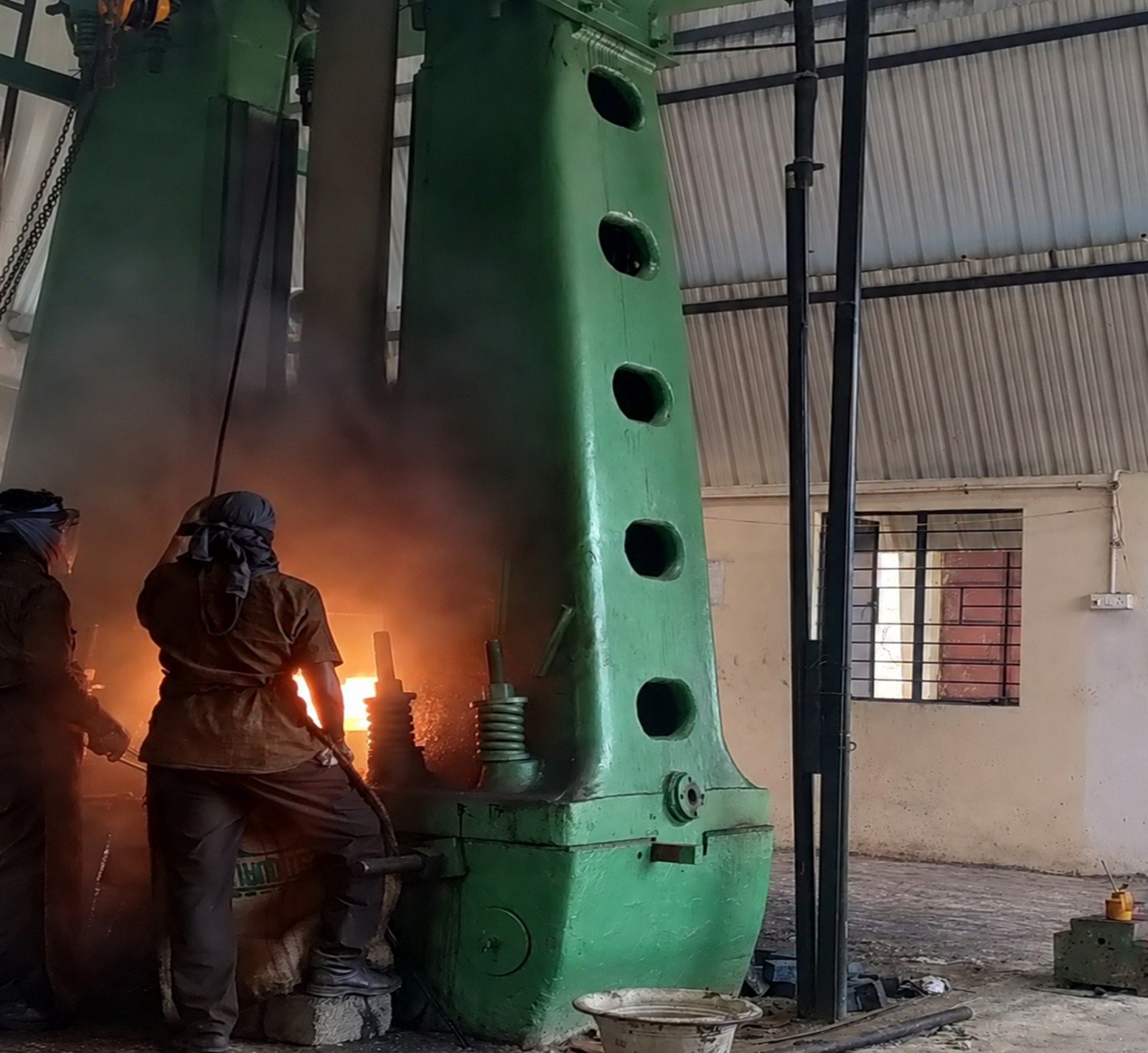 Industrial forge with glowing metal